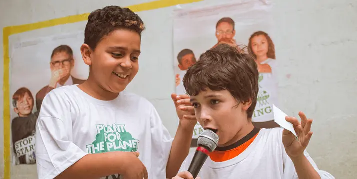Ambassadors giving a speech by Plant for the Planet