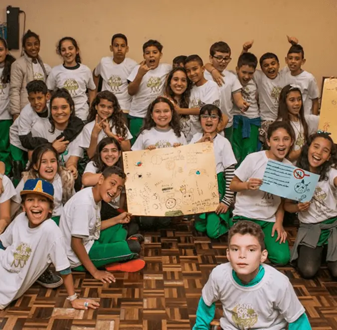 Ambassadors holding a poster by Plant for the Planet