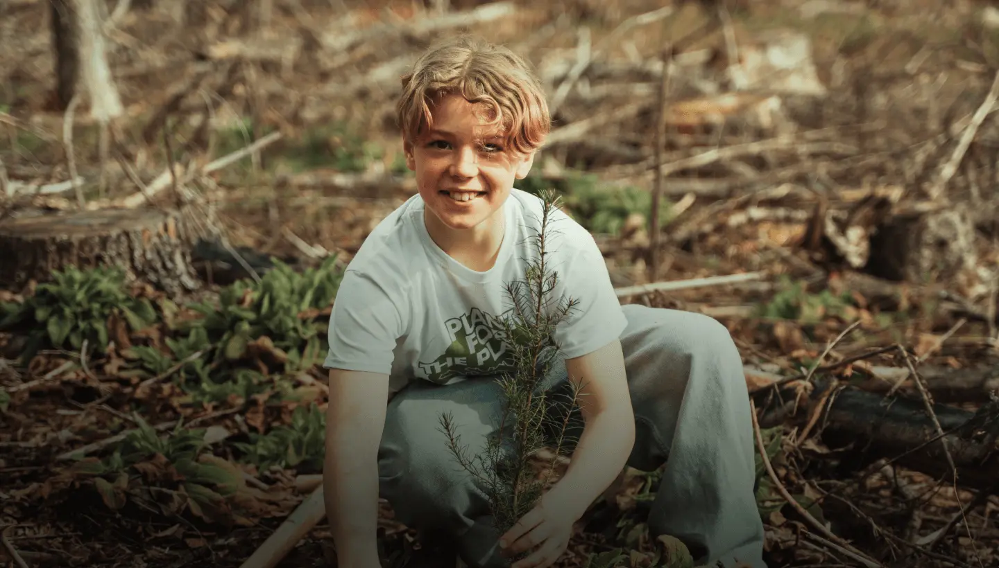 Ambassador planting trees by Plant for the Planet