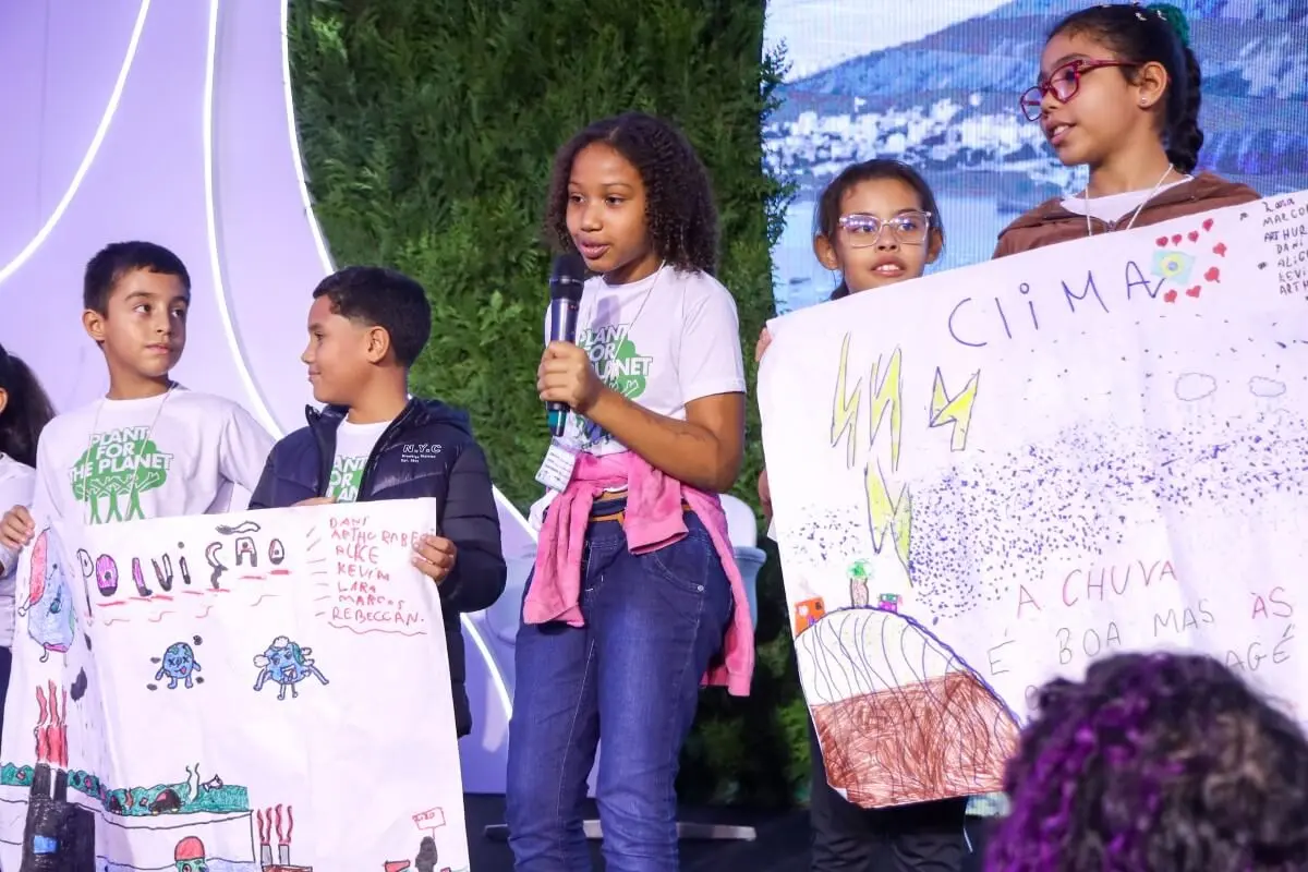 Ambassadors holding posters by Plant for the Planet