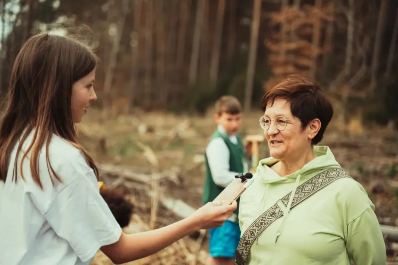 Ambassador interviewing someone by Plant for the Planet