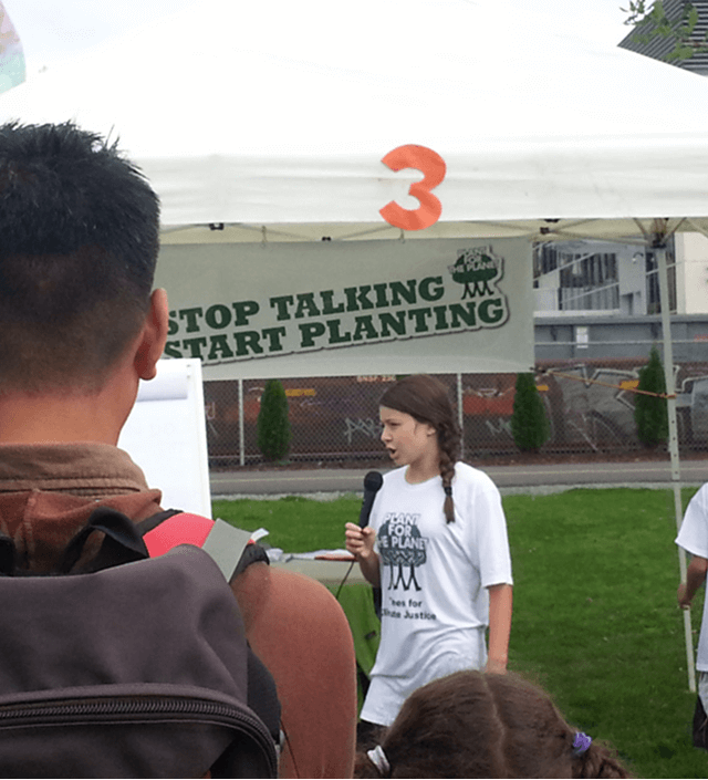 Ambassador speaking to crowd during tree planting event by Plant-for-the-Planet.
