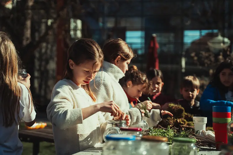 Ambassadors working on nature crafts by Plant for the Planet