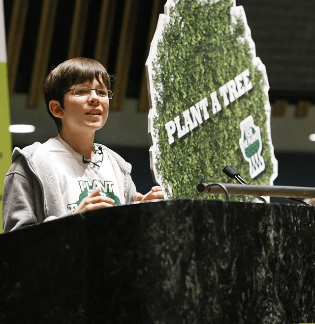 Felix giving a speech at a event by Plant for the Planet