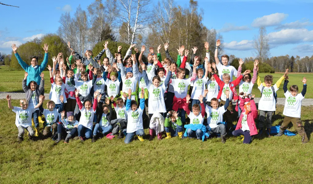 Group of ambassadors celebrating after tree planting by Plant-for-the-Planet.