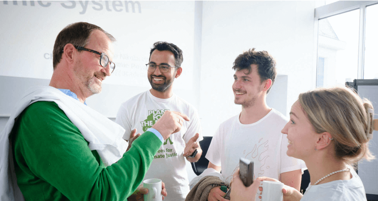 Jens talking with the team by Planet for the Planet