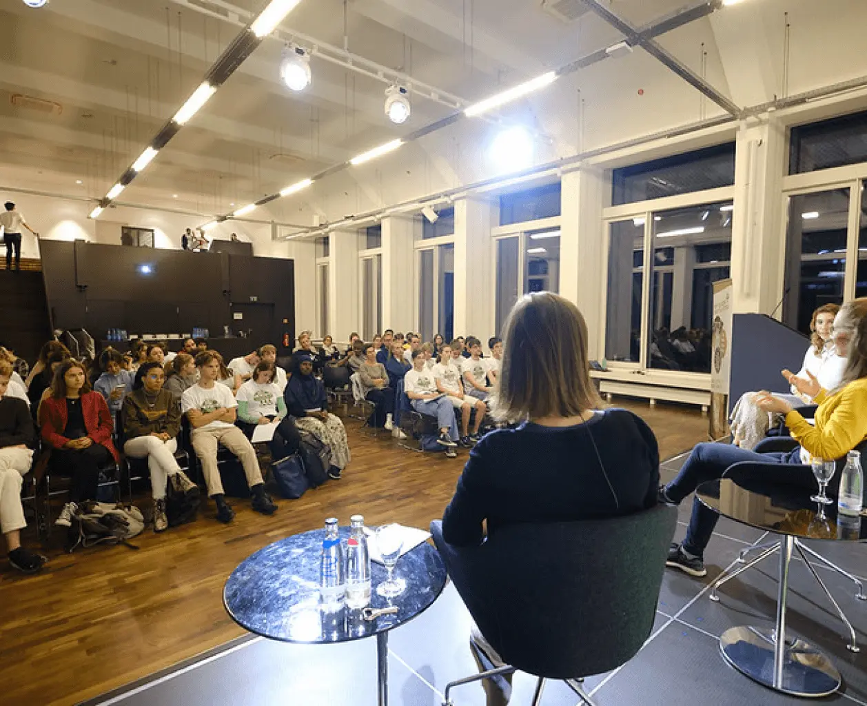 Panel discussion with audience at event by Plant-for-the-Planet.