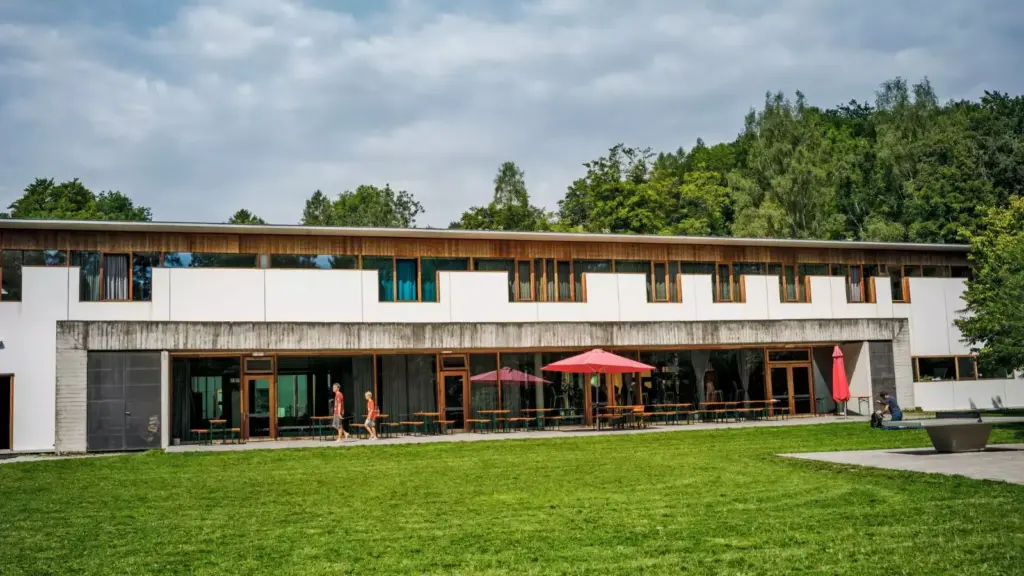 Dormitory room with bunk beds and desks by Plant-for-the-Planet.