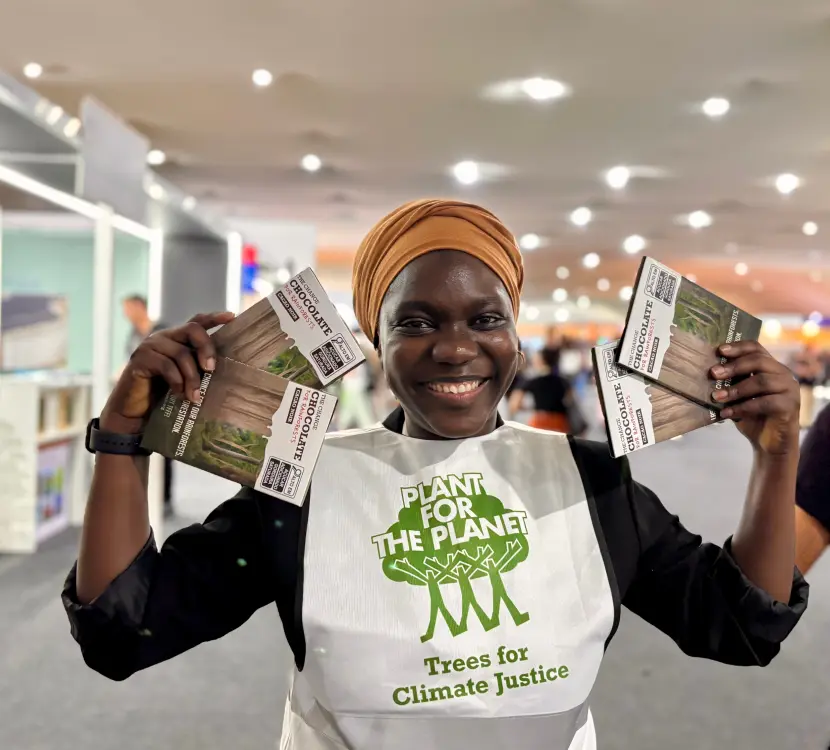 Fatou Jeng holding change chocolate by Plant-for-the-Planet