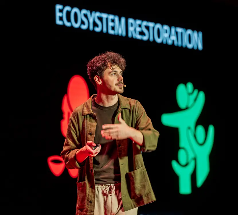 Simon explaining ecosystem restoration by Plant-for-the-Planet