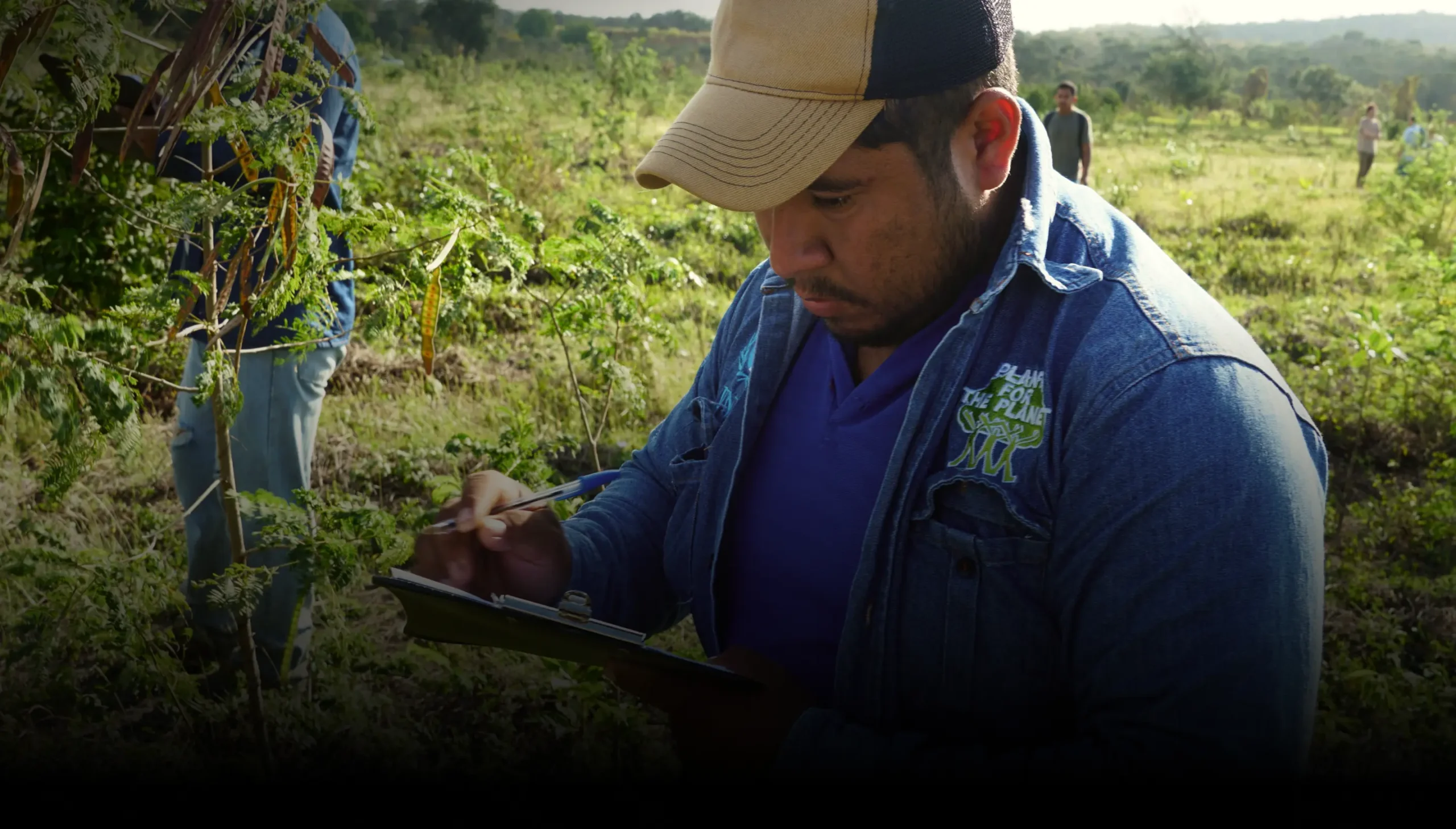 Field technician recording tree monitoring data by Plant-for-the-Planet